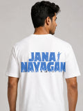 A man wearing a white short-sleeve t-shirt, viewed from the back. The shirt features a large blue graphic print on the back reading 'JANA NAYAGAN' with a silhouette of a person and a crowd at the bottom.
