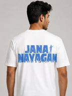 A man wearing a white short-sleeve t-shirt, viewed from the back. The shirt features a large blue graphic print on the back reading 'JANA NAYAGAN' with a silhouette of a person and a crowd at the bottom.